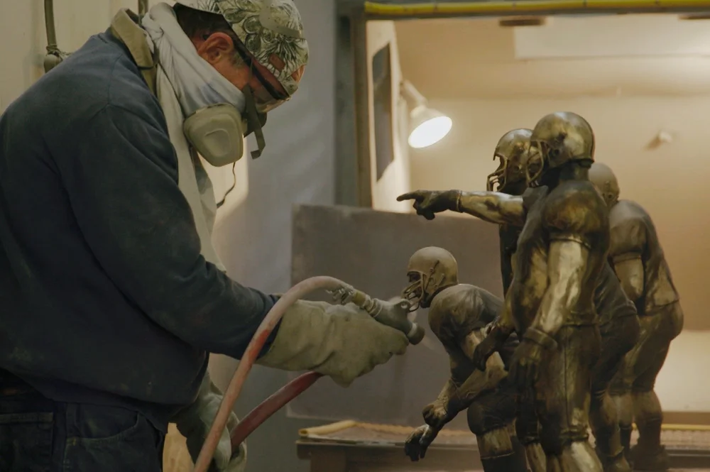 Jerry McKenna's foundry, the Joe Moore Award trophy being sandblasted before its unveiling